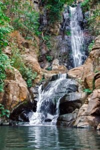 Beautiful cascading waterfall surrounded by lush greenery in Tequila, Mexico.